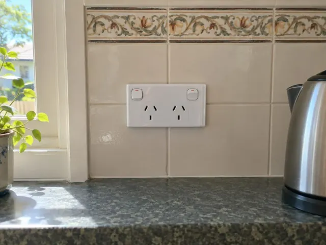 New double power point on a tiled kitchen splashback beside a bench in Redhead